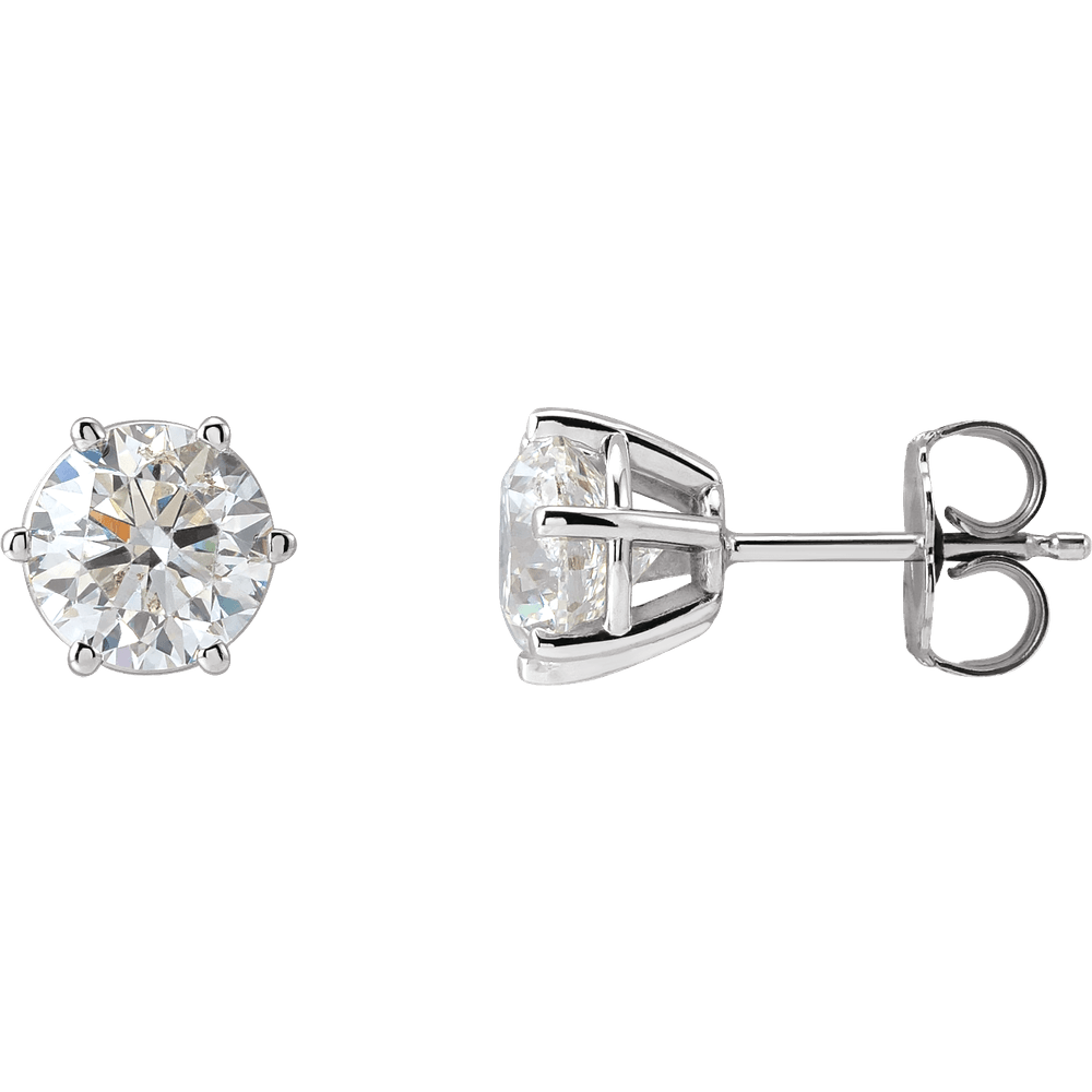 Pair of diamond stud earrings on a white background