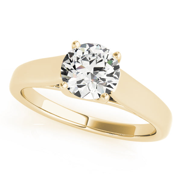 A gold wide band solitaire engagement ring with a central diamond.